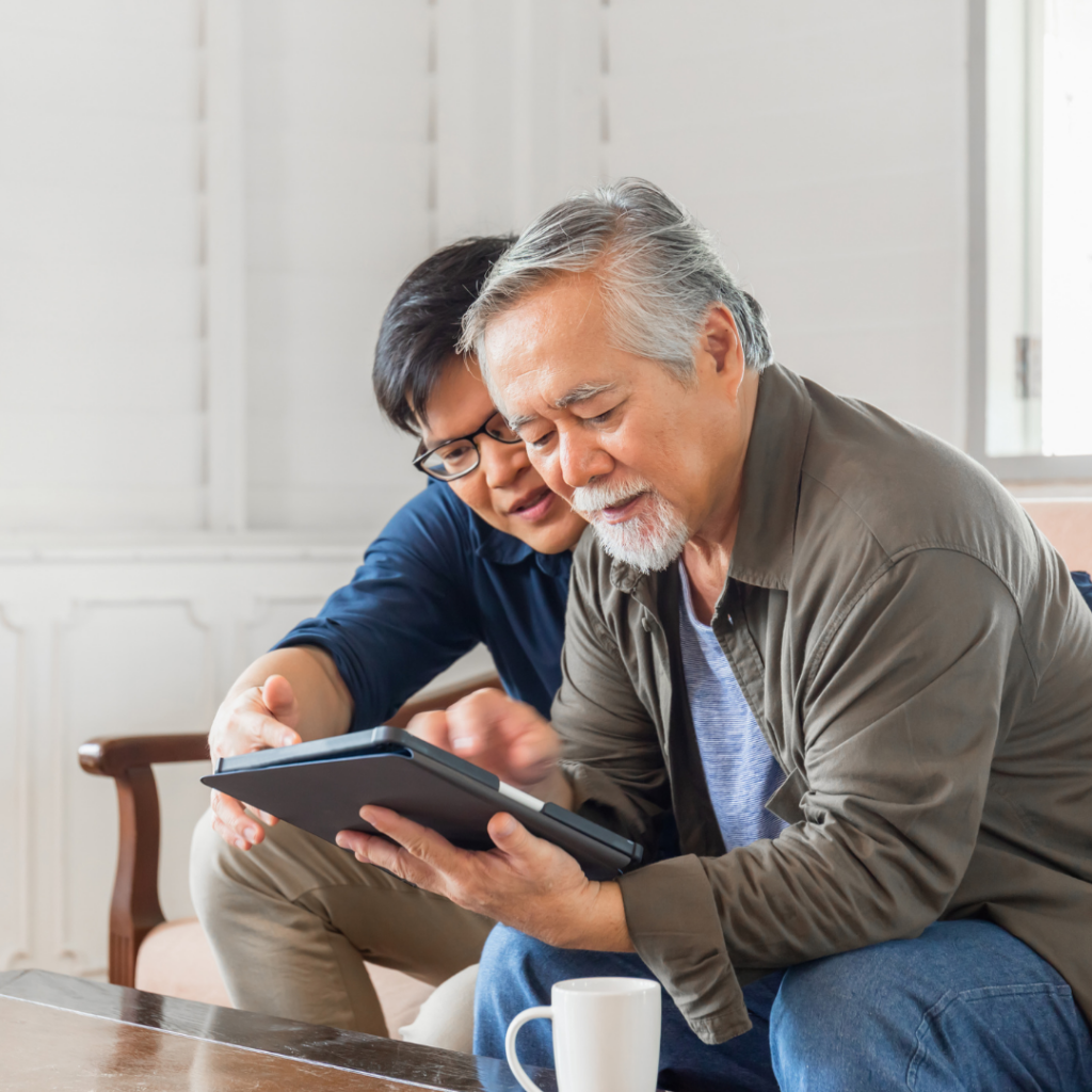Young-and-Older-Asian-Men-On-Tablet
