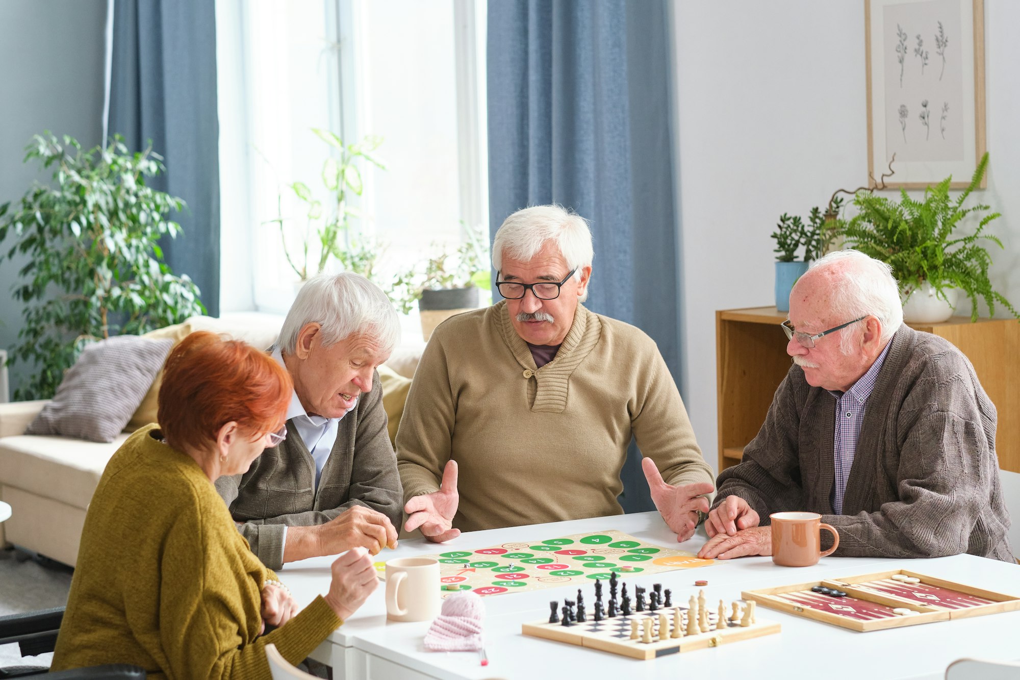 Elderly people playing board game